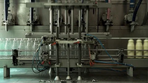 The filling of condensed milk in bottles Vídeos de archivo 73835066
