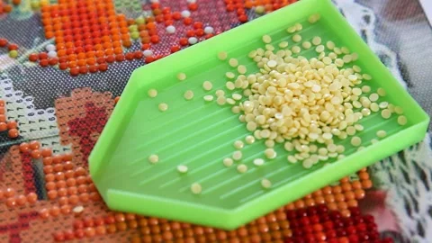 Filling container with acrylic rhinestones Stock Footage 159948431