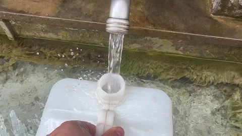 Filling the container with drinking water Stock Footage 248495191