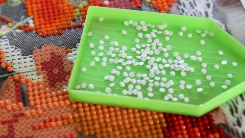 Filling container with rhinestones Stock Footage 159949361