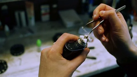 Filling cotton wool for vaping Stock Footage 73016192