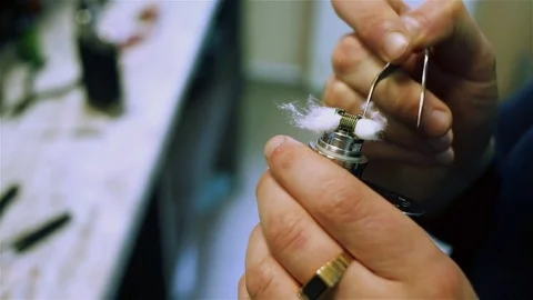 Filling cotton wool for vaping Stock Footage 73016261