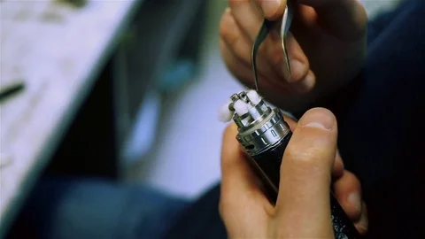 Filling cotton wool for vaping Stock Footage 73016489