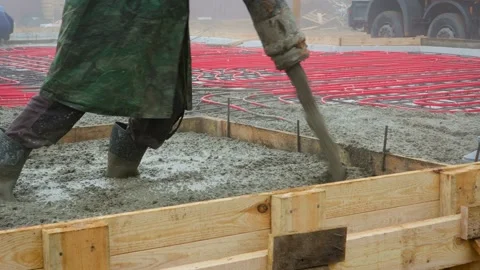 Filling of a coupler of a concrete floor with heating Stock Footage 99020150