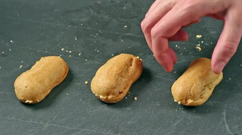 Filling cream three eclairs Stock Footage 58724117