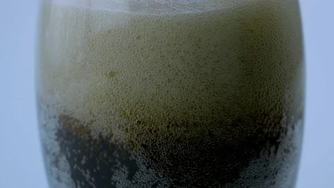 Filling up a cup with Coca-Cola close up, drops of water flowing down the glass Stock Footage 201006303