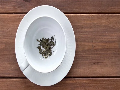 Filling cup with green tea, stop motion animation Stock Footage 84797784