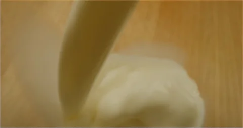 Filling up a cup with milk macro shot Video stock 126259366