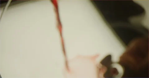 Filling up a cup with red wine macro shot Stock Footage 126259375