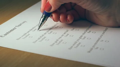 Filling Customer Survey, Close up of a woman's hand with pen Stock Footage 43219554