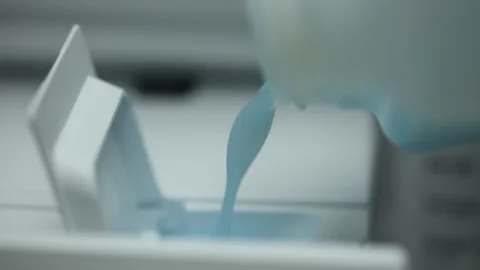 Filling detergent to modern washing machine Stock Footage 277764718