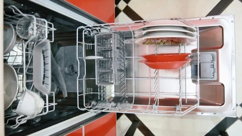 Filling dishes in the dishwasher Stock Footage 108529401