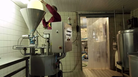 Filling a dispenser machine with Yogurt Video stock 36197021