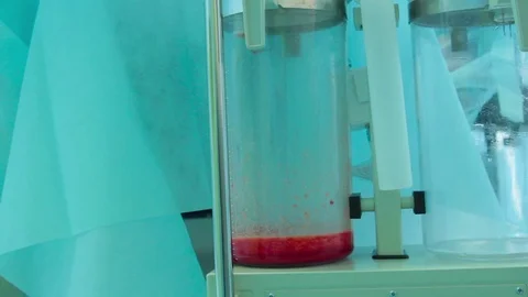 Filling flask of fat cells Stock Footage 70003346