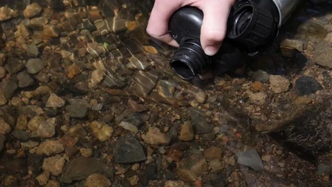 Filling WIth Flask From Stream In Slow Motion Stock Footage 91138897