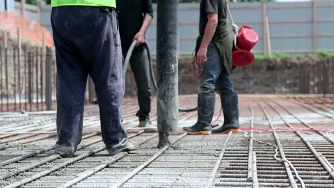 Filling foundation with concrete pump at construction site Stock Footage 208563561