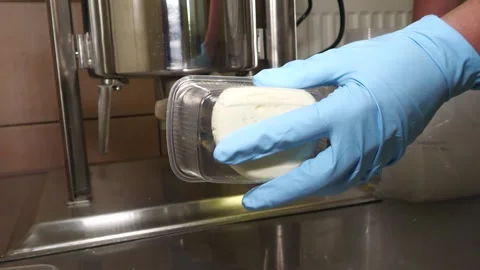 Filling Fresh Bryndza Into Retail Containers Video stock 343667405