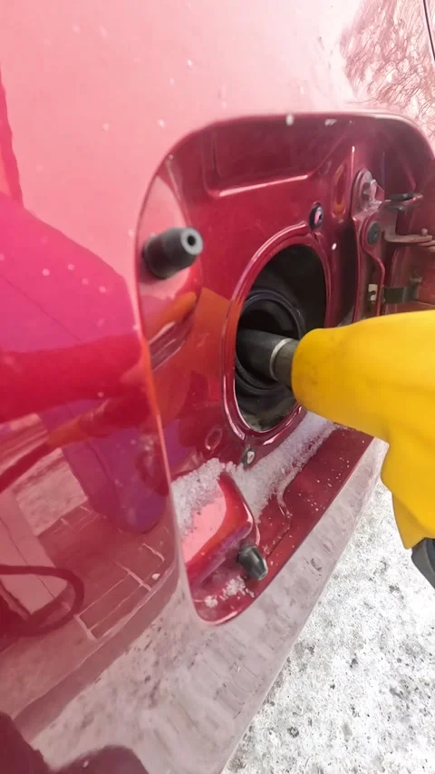 Filling the Fuel Tank: A Close-Up View of the Refueling Process in a Car's Gas Stock Footage 330532429
