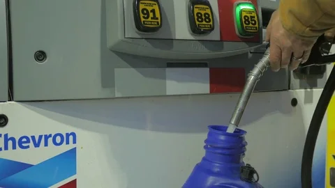 Filling gas can winter at the pump.  Stock Footage 71660804