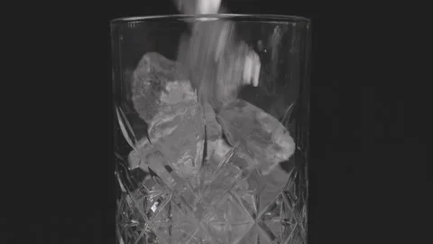 Filling Glas with Ice cubes in Slow Motion Stock Footage 242156299