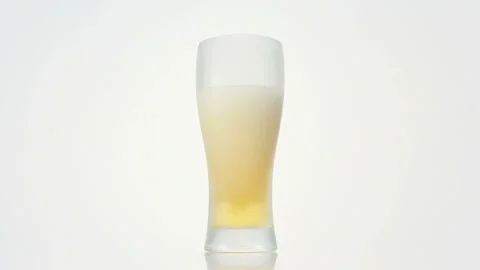 Filling the Glass with Beer Stock Footage 327403220