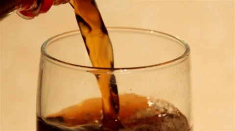 Filling a glass with coke Stock Footage 57633168