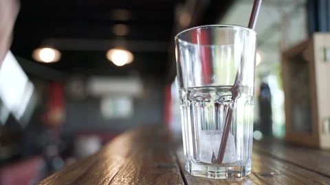 Filling the glass cup with ice Video stock 119828974