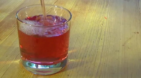 Filling Glass with Drink Stock Footage 53556148
