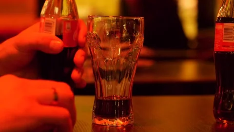 Filling the glass with a drink Stock Footage 74684369