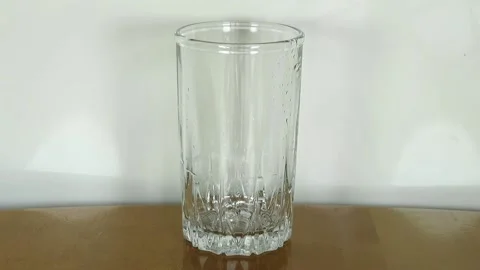 Filling a glass with water Stock Footage 134748719