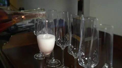 Filling glasses with sparkling wine. Close up. 스톡 동영상 148977309