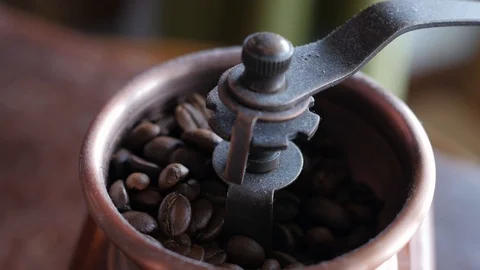 Filling hand mill with coffee beans 스톡 동영상 88125563