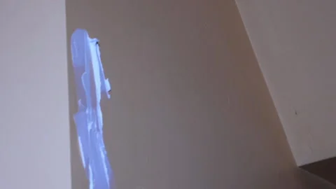 Filling A Hole In The Wall With Construction Material Close Up Stock Footage 145825706