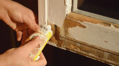 Filling The Holes In A Window Door Stock Footage 61535960