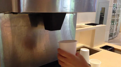 Filling ice to white cup Stock Footage 38422030
