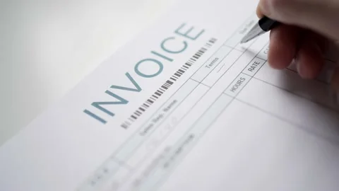 Filling an Invoice Bill by Hand Closeup Stockbeeldmateriaal 158118870