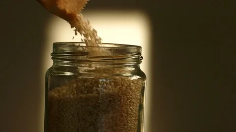 Filling jar with sesame Stock Footage 72845319