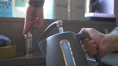 Filling Up A Kettle With Water From Tap Stock Footage 303660944