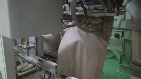 Filling a Large Paper Bag With Processed Green Tea Stock Footage 340009845