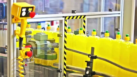 Filling line of liquid detergent in the plastic bottles Stock Footage 70152970