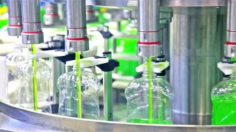 Filling line of liquid in the plastic bottles Stock Footage 70159054