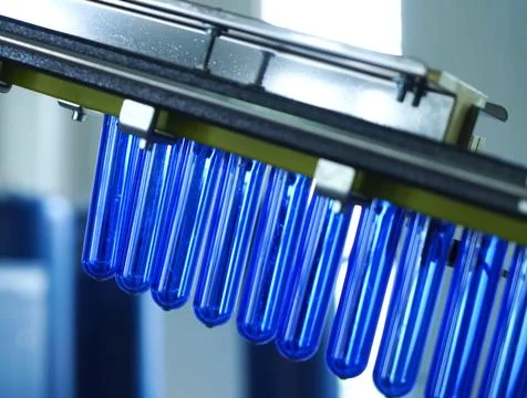 Filling line in plastic flasks. Liquid Filling Stock Photos