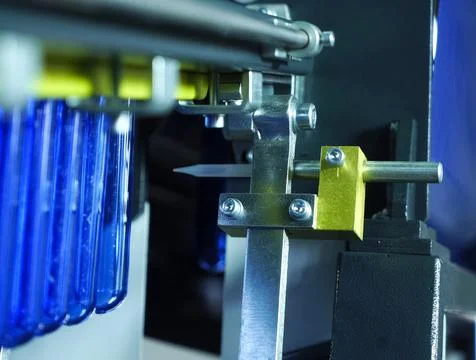 Filling line in plastic flasks. Liquid Filling Stock Photos