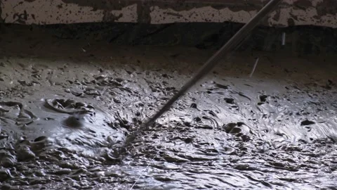 Filling with liquid monolithic foam concrete for warming of building. Stock Footage 153584570