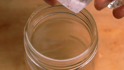 Filling a mason jar with ice Stock Footage 91505857