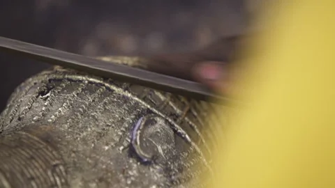 Filling a metal sculpture. Close up Stock Footage 260696255