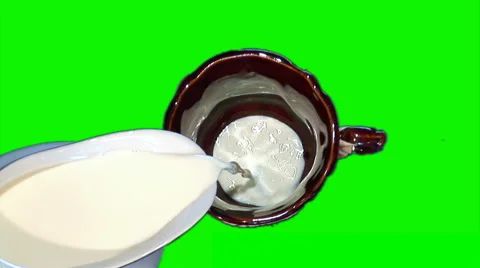 Filling milk in brown mug Stock Footage 43171279