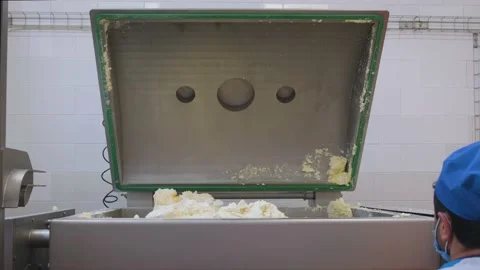 Filling the mixing machine with curd in a dairy plant Stock Footage 161510497