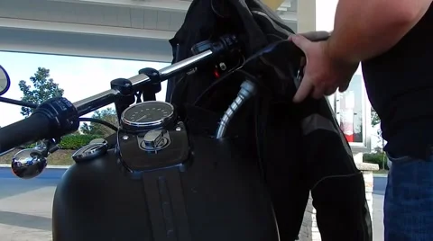 Filling up motorcycle at gas pump Stock-Footage 45457507