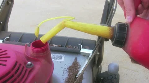 Filling mower with gas Stock Footage